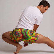 Neon Radial Burst Athletic Shorts - Vibrant Psychedelic Swim Trunks for Bikram Yoga & Rave Fitness by Aesthetic Rebellion