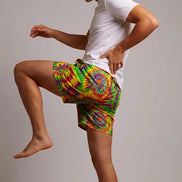 Neon Radial Burst Athletic Shorts - Vibrant Psychedelic Swim Trunks for Bikram Yoga & Rave Fitness by Aesthetic Rebellion