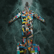 Scrap Quilt hazmat suit costume by Dyles Mavis — full-body hooded hazmat suit with all-over print of a colorful patchwork scrap-collage in orange, teal, pink, black and yellow, flat lay on dark marble
