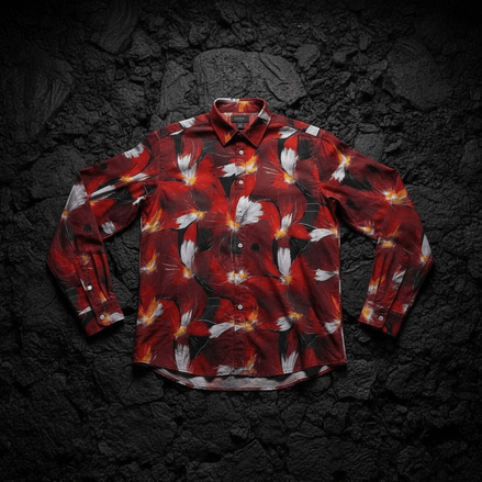 Crimson Plume Bloom long sleeve polo by Dyles Mavis — 220gsm polo shirt with all-over print of painterly crimson and white plumed floral blooms on a black ground, front flat lay