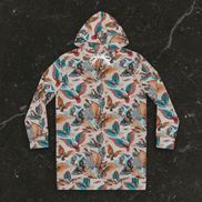 Aviary Fieldbook hoodie dress by Dyles Mavis — women's mid-thigh pullover hoodie dress with all-over print of a maximalist bird and botanical collage in teal, rust, tan and grey, back view flat lay on dark marble