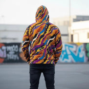 Painted strata zip hoodie detail showing layered amber and cobalt brush strokes