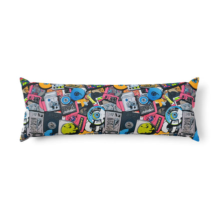 Gadget Pop AOP Body Pillow — long body pillow with retro tech pop art collage AOP featuring boomboxes, vinyl records, cameras, headphones, and skateboards in vivid pink, cyan, and yellow on dark navy. Aesthetic Rebellion.