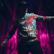 Tag Wall Bomber Jacket with full-coverage graffiti throw-ups and tags in red, blue, yellow, and white on white base