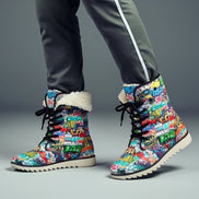 Graffiti Tag Shearling Boots with all-over multicolor graffiti tag AOP print and white shearling lining, shown on feet