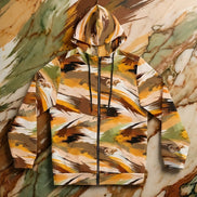 Autumn Brushstroke Zip Hoodie women's full-zip in warm ochre, caramel, olive, rust, and cream sweeping brushstroke pattern with drawstring hood, flat lay on marble