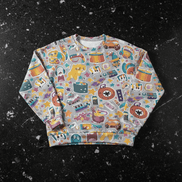 Toy Parade Hacci Knit Sweater drop-shoulder pullover in soft gray covered with playful toy stickers including drums, rubber ducks, stars, cassettes, and clocks in gold, teal, and coral