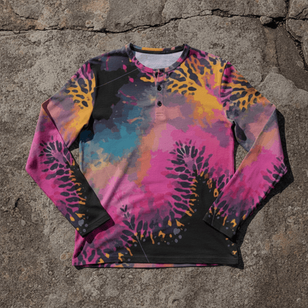 Long-sleeve Henley shirt with vivid hot pink and gold organic coral sea-anemone splatter all-over print on dark purple-black background