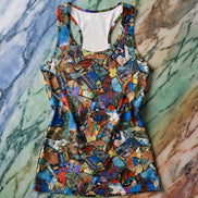 Mosaic Carnival Racerback Dress bodycon cut with fragmented art mosaic collage in blue, tan, red, teal, and gold shards, racerback strap detail, flat lay on marble