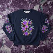 Neon Handprint Crewneck in navy heavy blend fabric with cluster of UV-glow handprints in violet and magenta with orange paint splashes on chest and matching prints down both sleeves